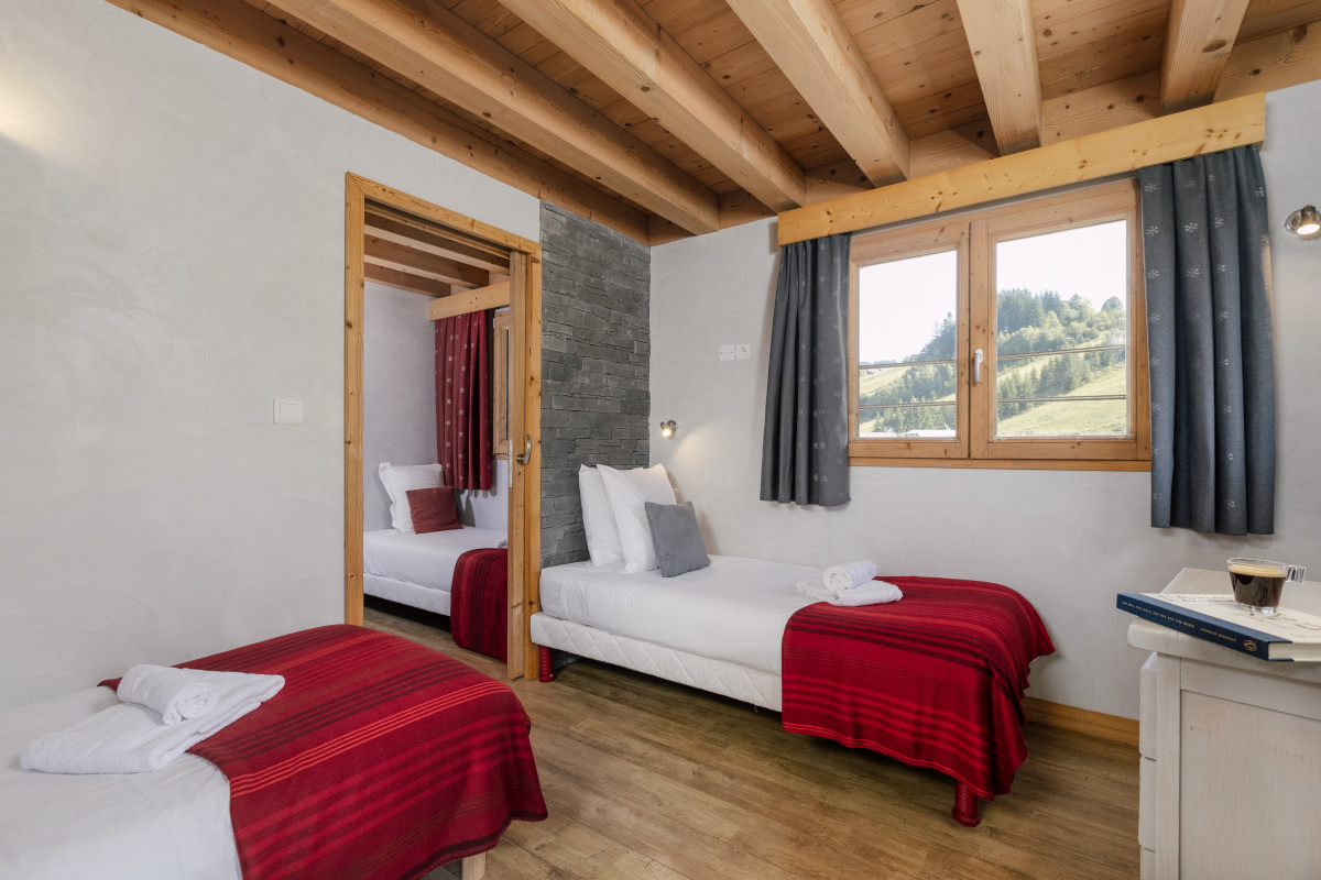 Suite-de-l-Alpe-Marcelly-chambre-lits-simples-location-appartement-chalet-Les-Gets