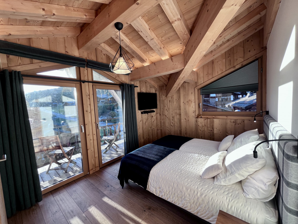 Teleporte-chambre-piste-noire-lit-double-location-appartement-chalet-Les-Gets