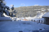 chalet-cocoon-vue-hiver-jaccuzi-location-appartement-chalet-Les-Gets