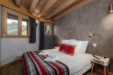 Suite-de-l-Alpe-Aiguille-du-Midi-chambre-lit-double-location-appartement-chalet-Les-Gets