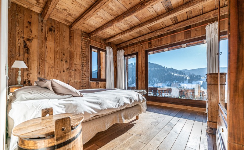 Ferme-du-Crinaz-chambre-lit-double-vue-balcon-location-appartement-chalet-Les-Gets