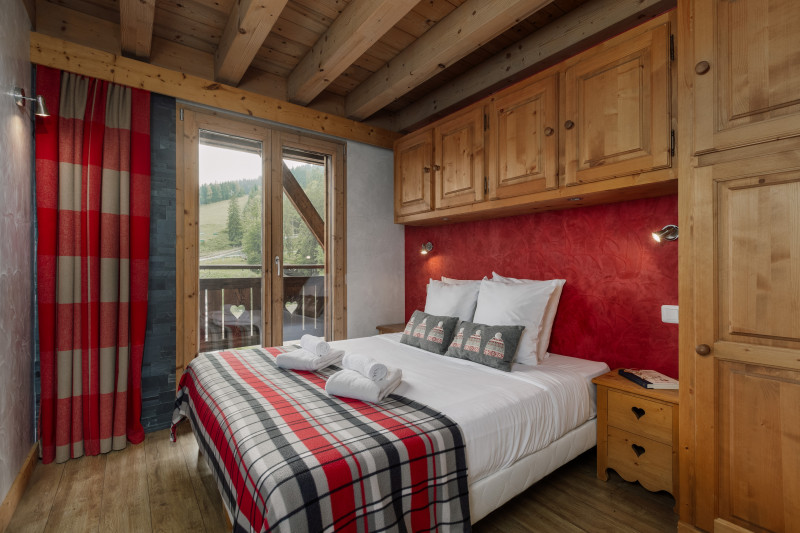 Suite-de-l-Alpe-Mont-Blanc-chambre-lit-double-location-appartement-chalet-Les-Gets