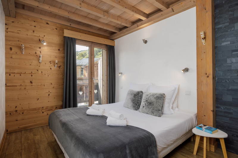 Suite-de-l-Alpe-Mont-Chery-chambre-lit-double-location-appartement-chalet-Les-Gets