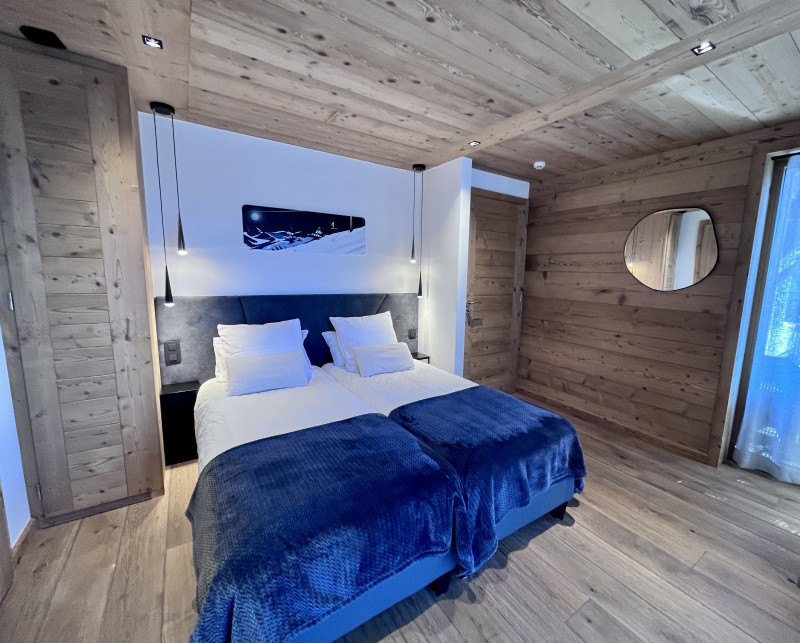 Teleporte-chambre-piste-bleue-lit-double-location-appartement-chalet-Les-Gets