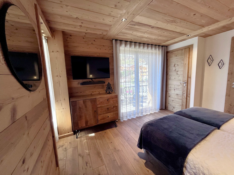 Teleporte-chambre-piste-bleue-lit-double-location-appartement-chalet-Les-Gets