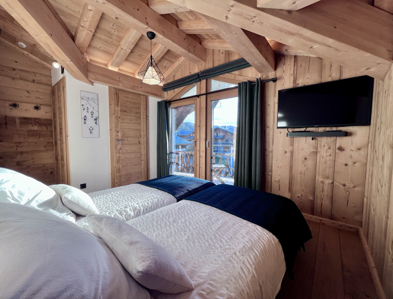 Teleporte-chambre-piste-noire-lit-double-location-appartement-chalet-Les-Gets